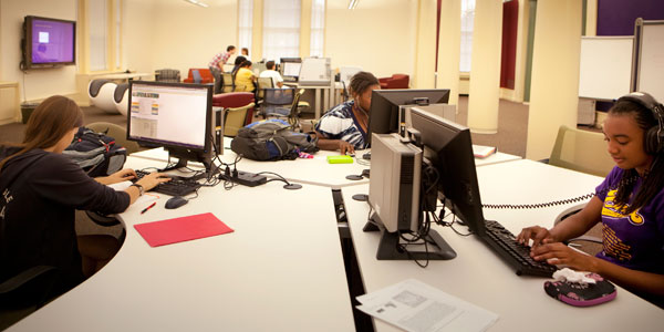 Students at computer stations in Stockwell Library's Cutler Commons.
