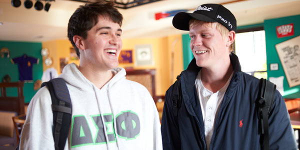 Two Albion College students outside the Eat Shop in the Kellogg Center.