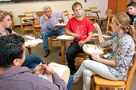 Education professor Kyle Shanton with students