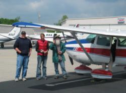 Mike, Lindsay, and Wes prepare for their Southwings flight