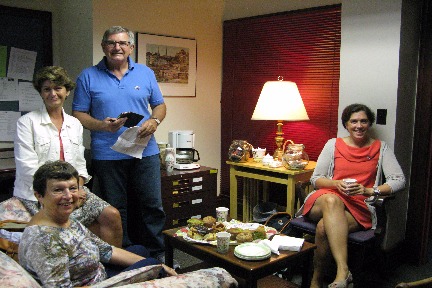 Residents of Albion enjoying barbecue in an office on Albion College's campus. 