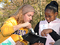 Abby Williams, '12, works with a student from the University Prepatory Academy