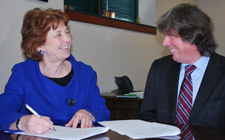 Albion President Donna Randall and Martin O'Connor, director of the International Center for Research in Ecological Economics, Eco-Innovation & Tool Development for Sustainability at UVSQ, sign the agreement implementing two new programs for Albion students that will involve them in sustainability studies on both institutions' campuses.