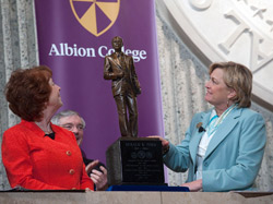Albion College President Donna Randall and Susan Ford Bales unveil the President Ford maquette.