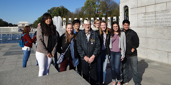 Students in Dr. Wes Dick's Albion and the American Dream First-Year Seminar met Pearl Harbor survivor Adone "Cal" Calderone at the World War II Memorial during a visit to Washington, D.C. in November. 