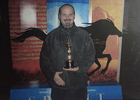 Jason Moritz, a DreamWorks SKG employee in the eary 2000s, with the Best Animated Feature Oscar won by Shrek.
