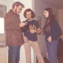 Dr. Johan Stohl with Bill Minnich, '72, and Meg (Dawe) Minnich, '74, inside 1213 E. Erie St. in 1973. All were involved in the Fall 1973 student-created, living-learning course officially titled Religious Studies 381: Values and Value Theory.