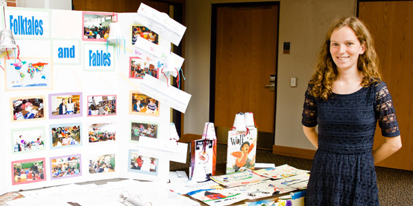 An Albion College student presents her portfolio during the 2013 Maymester Showcase.