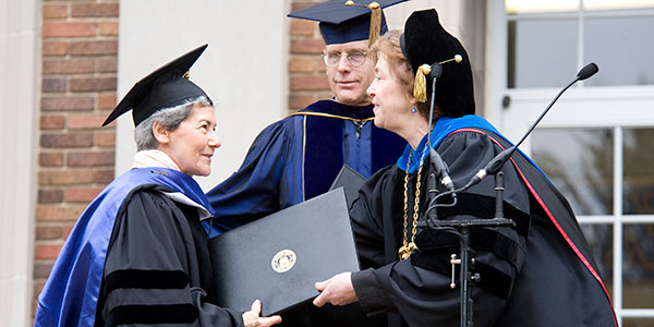 Miriam Winter, history professor Geoffrey Cocks, and President Donna Randall at 2009 Commencement.