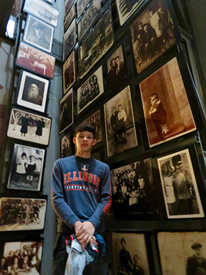 First-year student Ricardo Rocha stands amid the museum's "Tower of Life" exhibit.