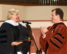 Interim President Mike Frandsen greets Susan Ford Bales following the conferral of an honorary doctorate.