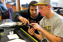 Albion College physics students in the lab.