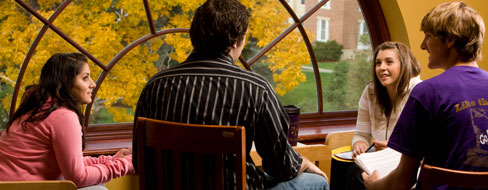 Students meet at the top floor of the Kellogg Center, at the arch window.