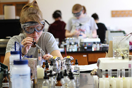 An Albion College chemistry student at work in the lab.