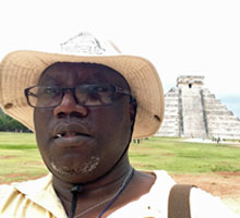 Olapade at a research site in Belize, where he demonstrated that microbes contributes to the deterioration of Mayan stone carvings and monuments.