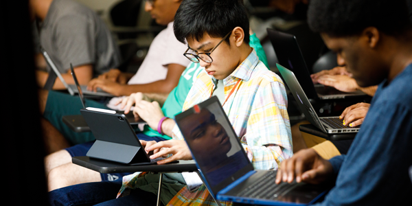 Students using laptops.
