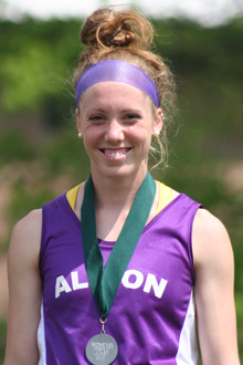 Kristin Nelson sports one of the medals she earned during the 2012 MIAA Track & Field Championship.