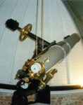 The 8-inch Alvan Clark refractor telescope in the Albion College Observatory Building.